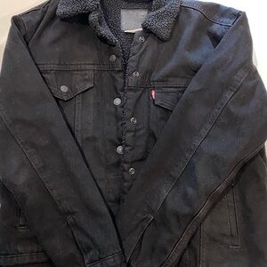 Levi's Black Sherpa-Lined Jacket. The color is a dark black.